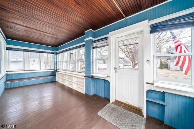 unfurnished sunroom featuring wooden ceiling