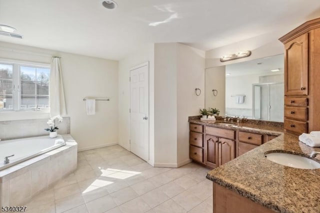 full bathroom with tile patterned floors, baseboards, a bath, and vanity