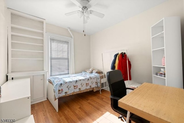 bedroom featuring a ceiling fan and wood finished floors