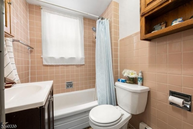 bathroom with toilet, shower / bath combo, vanity, and tile walls