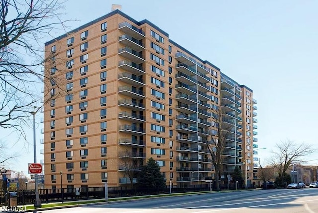 view of building exterior with fence