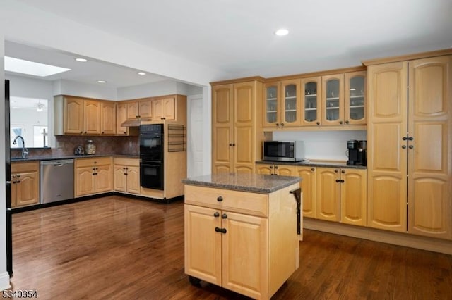 kitchen with dark wood-style floors, stainless steel appliances, glass insert cabinets, and recessed lighting