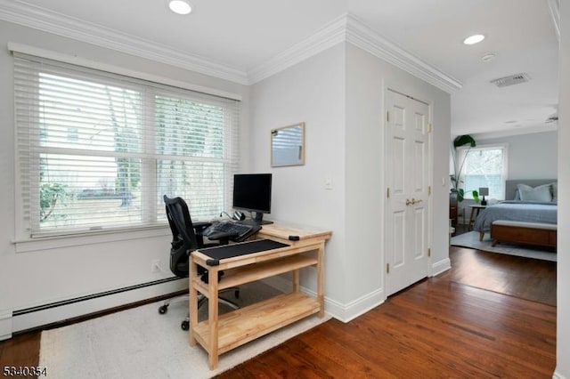 office area featuring a wealth of natural light, a baseboard radiator, ornamental molding, and wood finished floors