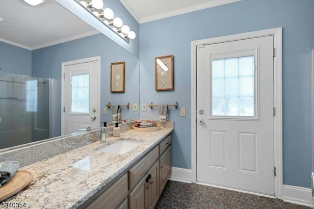 full bath with a shower, crown molding, vanity, and baseboards