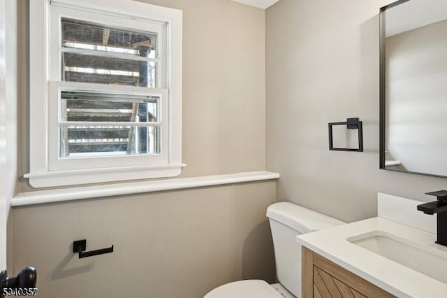 half bath with vanity and toilet