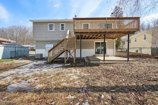 back of house featuring central air condition unit, stairway, a patio area, fence, and a deck