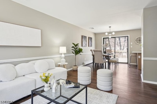 living room with dark wood-style floors and baseboards