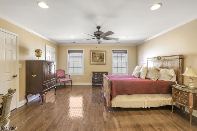 bedroom with baseboards, wood finished floors, ornamental molding, and a ceiling fan