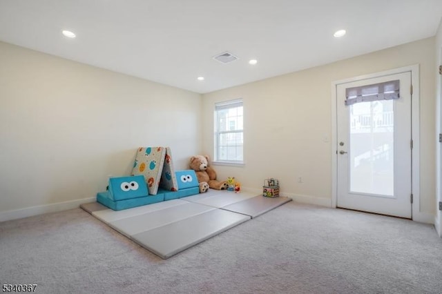 rec room with light carpet, baseboards, visible vents, and recessed lighting