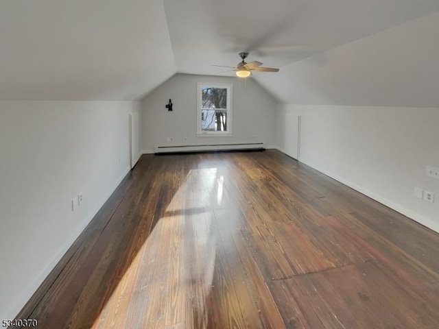 additional living space featuring lofted ceiling, ceiling fan, a baseboard heating unit, and wood finished floors