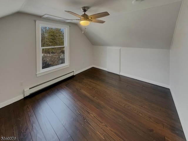 bonus room featuring hardwood / wood-style flooring, a baseboard radiator, baseboards, and vaulted ceiling