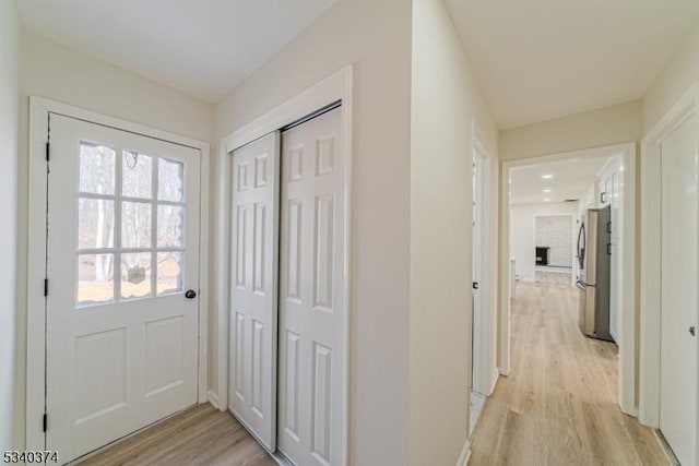 hallway featuring light wood-style flooring