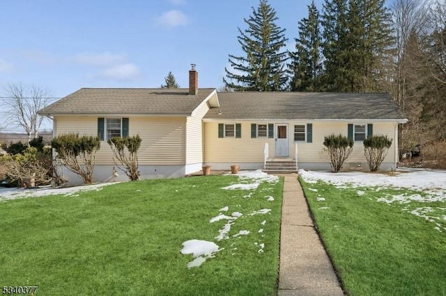 ranch-style home with a chimney and a front yard