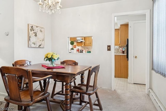 dining space featuring a baseboard radiator, light carpet, and an inviting chandelier