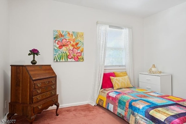 carpeted bedroom featuring baseboards