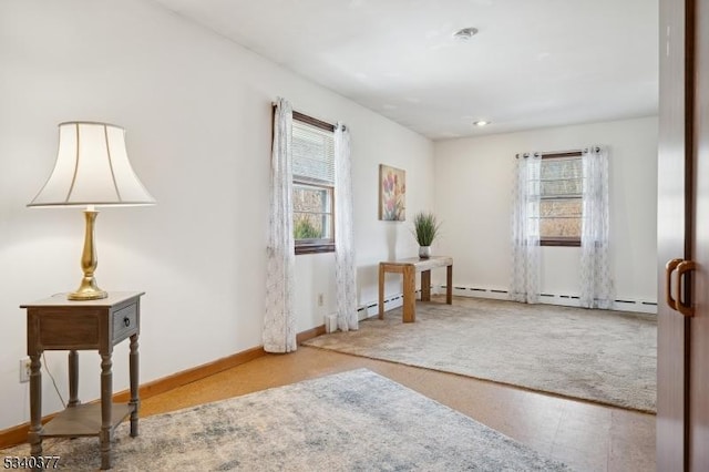 sitting room with carpet and baseboards