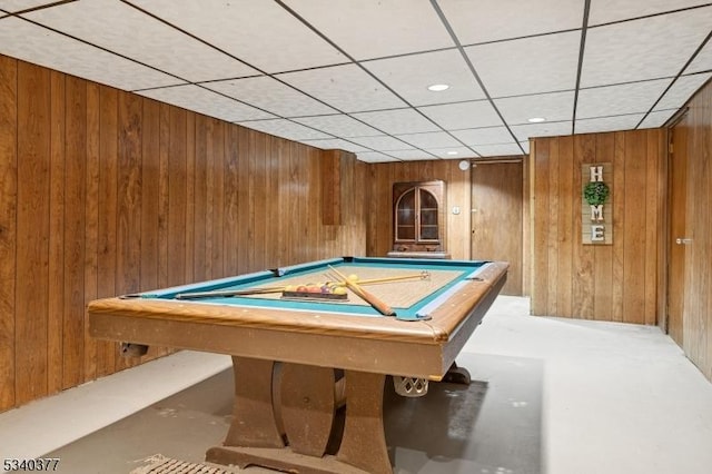 recreation room with pool table and wooden walls