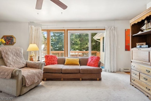 living room featuring a baseboard radiator, ceiling fan, and light colored carpet