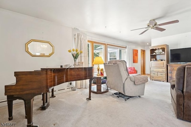 sitting room featuring light carpet and ceiling fan