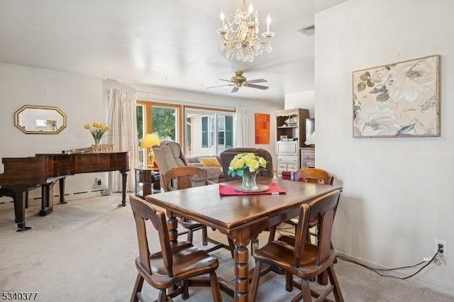 dining space with a ceiling fan, carpet, and visible vents