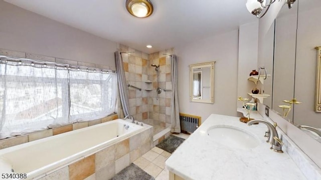 bathroom featuring a stall shower, radiator heating unit, a garden tub, tile patterned flooring, and vanity