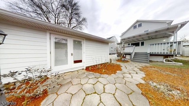 exterior space featuring a deck and french doors