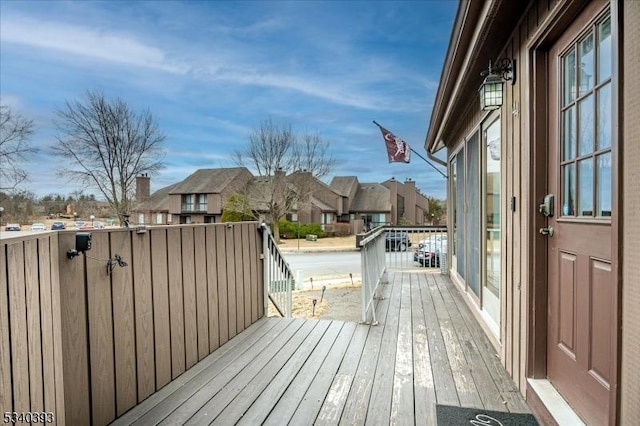 wooden deck with a residential view