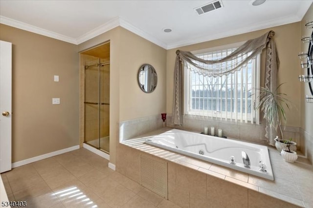 full bath featuring ornamental molding, tile patterned flooring, a garden tub, and visible vents