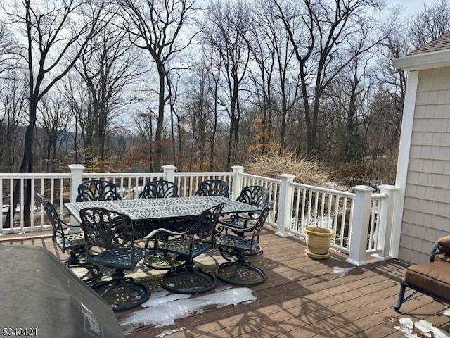 wooden deck featuring outdoor dining area