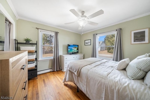 bedroom featuring light wood-type flooring, a baseboard radiator, multiple windows, and crown molding