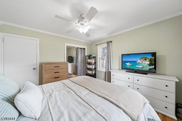 bedroom featuring a ceiling fan and crown molding