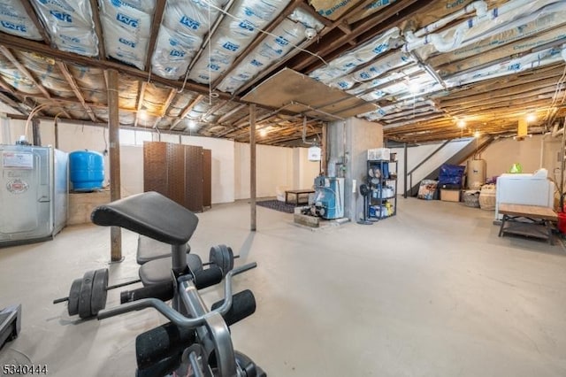 workout area featuring gas water heater