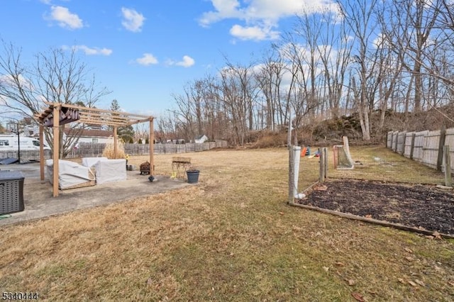 view of yard with a patio area, fence, and a pergola