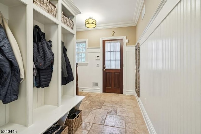 mudroom featuring visible vents, stone tile floors, and crown molding