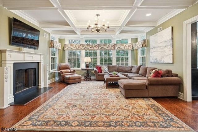 sunroom featuring beamed ceiling, visible vents, coffered ceiling, an inviting chandelier, and a fireplace