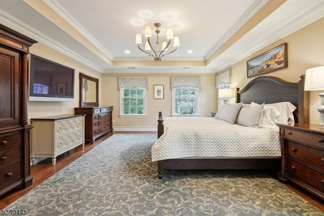 bedroom featuring baseboards, dark wood finished floors, a chandelier, ornamental molding, and a raised ceiling