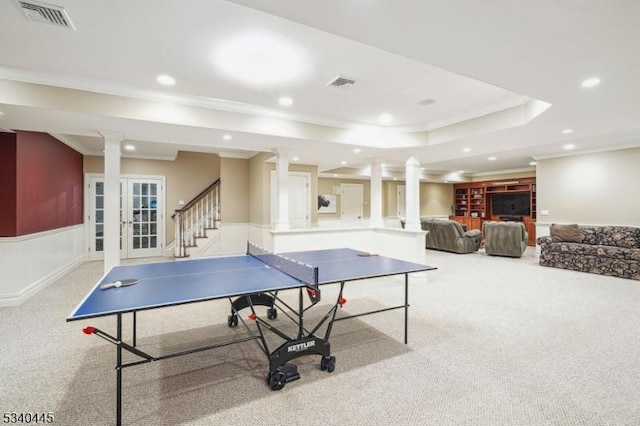 playroom featuring a tray ceiling, visible vents, and carpet floors