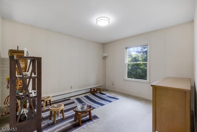 living area featuring carpet floors, a baseboard radiator, and baseboards