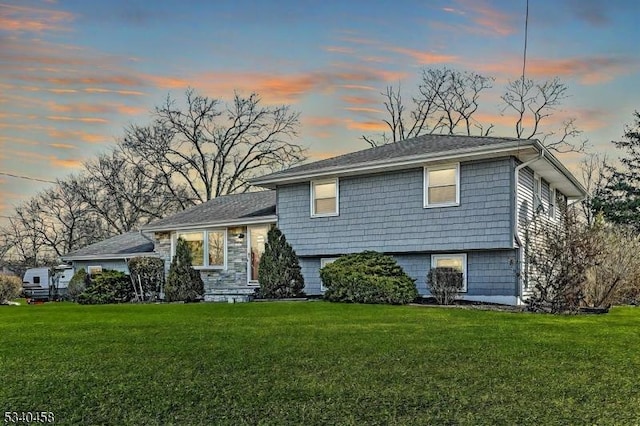 tri-level home featuring a front yard