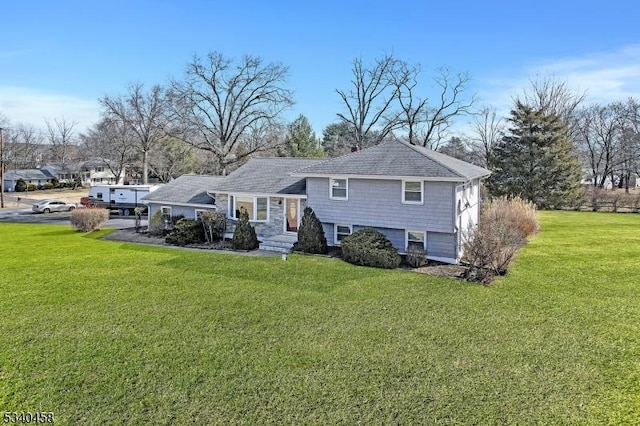 back of house featuring a yard