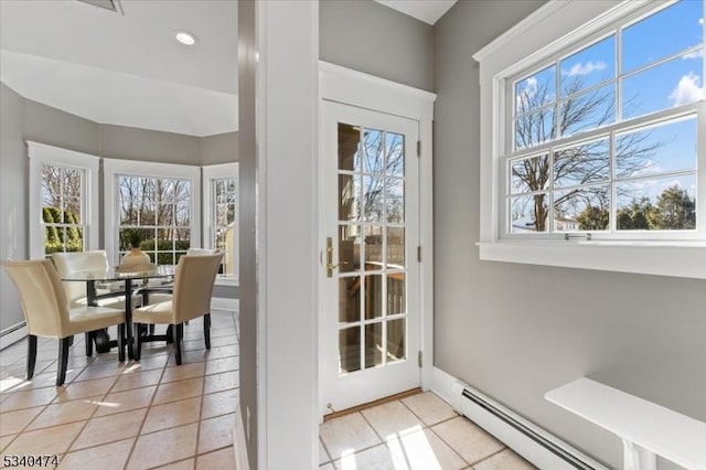 entryway featuring recessed lighting, a baseboard radiator, and light tile patterned flooring