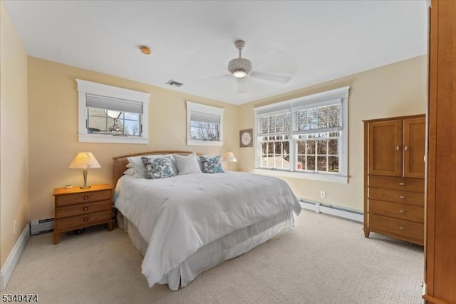 bedroom featuring ceiling fan, a baseboard radiator, visible vents, and light colored carpet