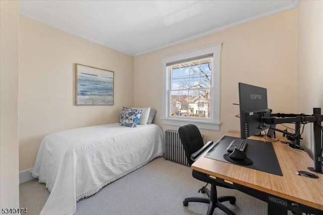 carpeted bedroom with ornamental molding and radiator