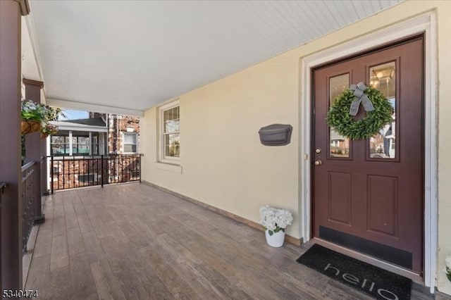 view of exterior entry featuring stucco siding