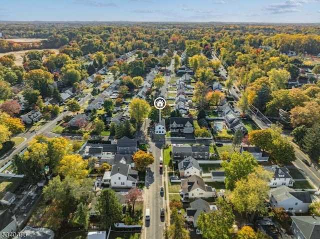 birds eye view of property with a residential view