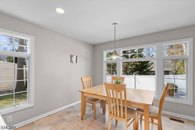 dining area with baseboards and visible vents