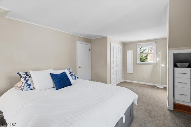 carpeted bedroom with baseboards