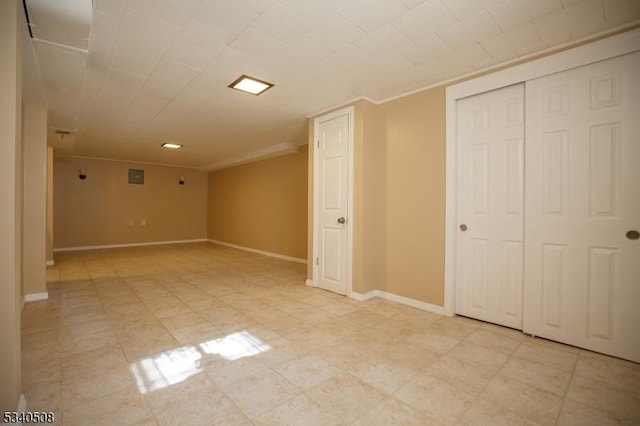 finished basement featuring baseboards