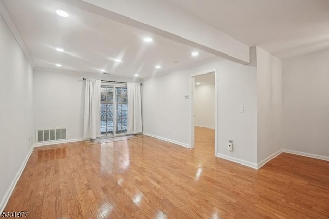 unfurnished room featuring recessed lighting, light wood-type flooring, visible vents, and baseboards