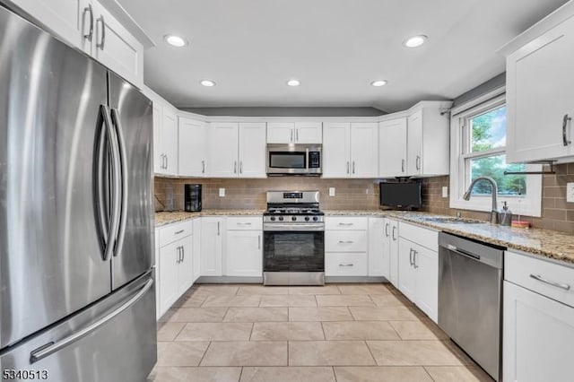 637 Bensel Dr, Mount Arlington Boro, NJ 07850 - kitchen featuring appliances with stainless steel finishes, a sink, backsplash, recessed lighting, and white cabinetry